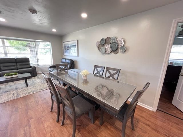 Living and dining area with a long table and a sofa at a Serenity Living home
